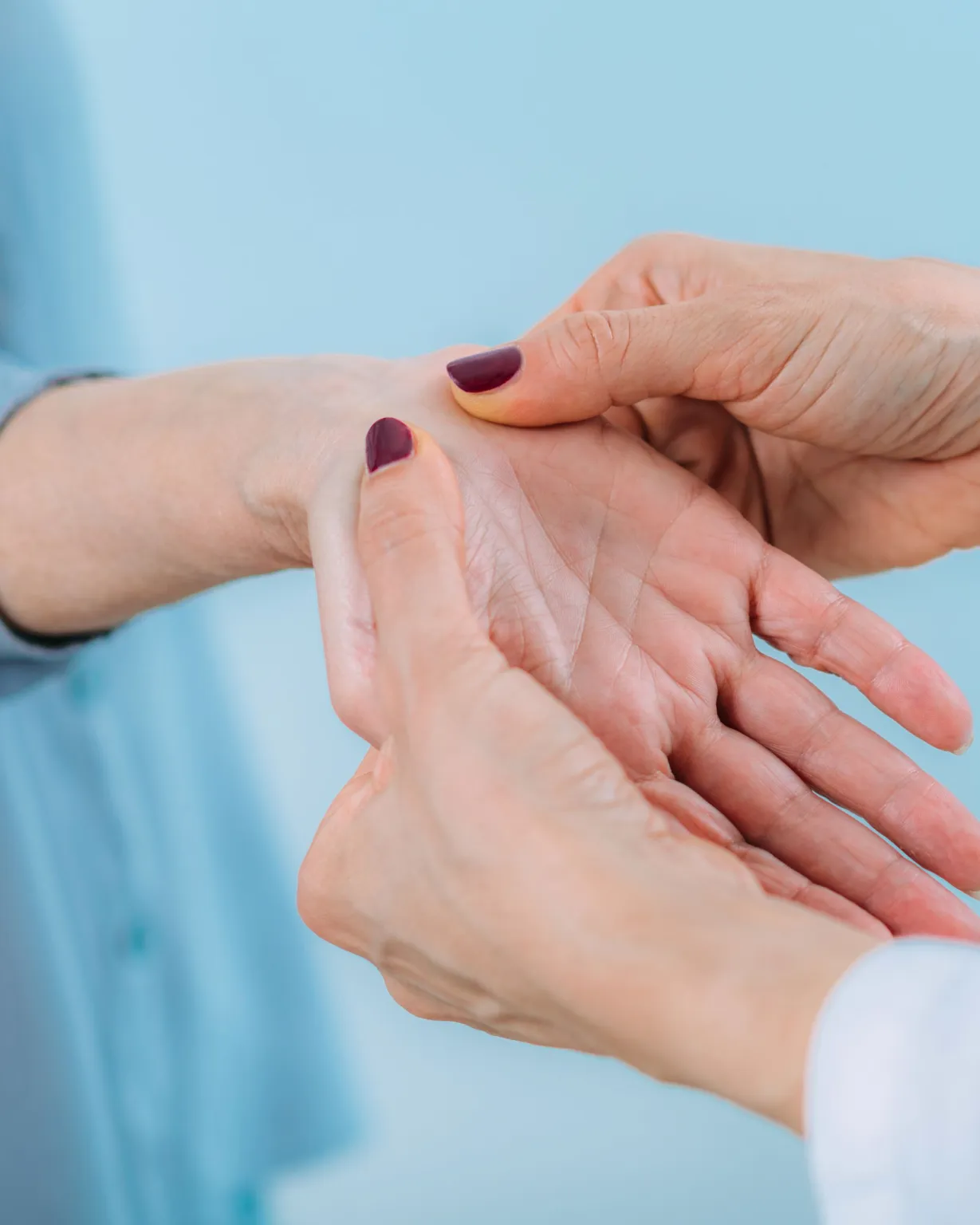 Doctor adjusting wrist alignment for carpal tunnel relief in Lenexa, Kansas