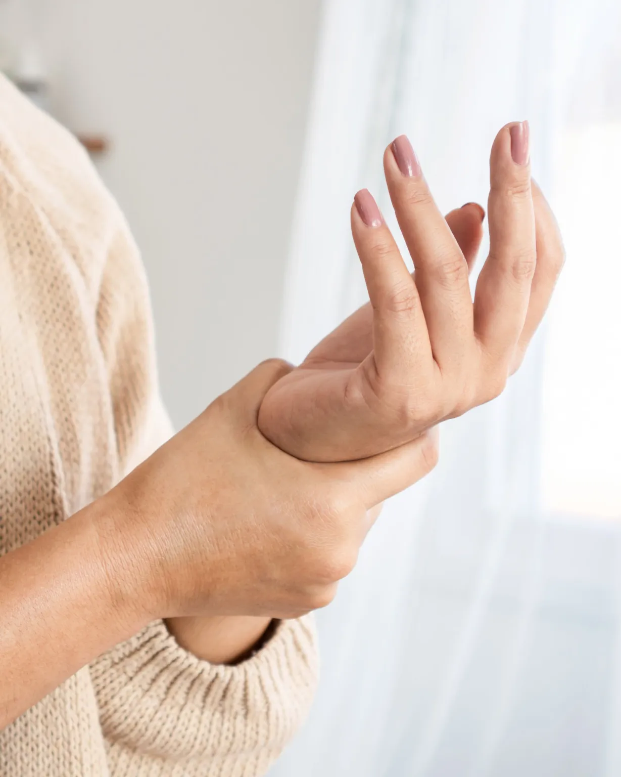 Doctor adjusting elbow and wrist for upper extremity pain in Lenexa, KS